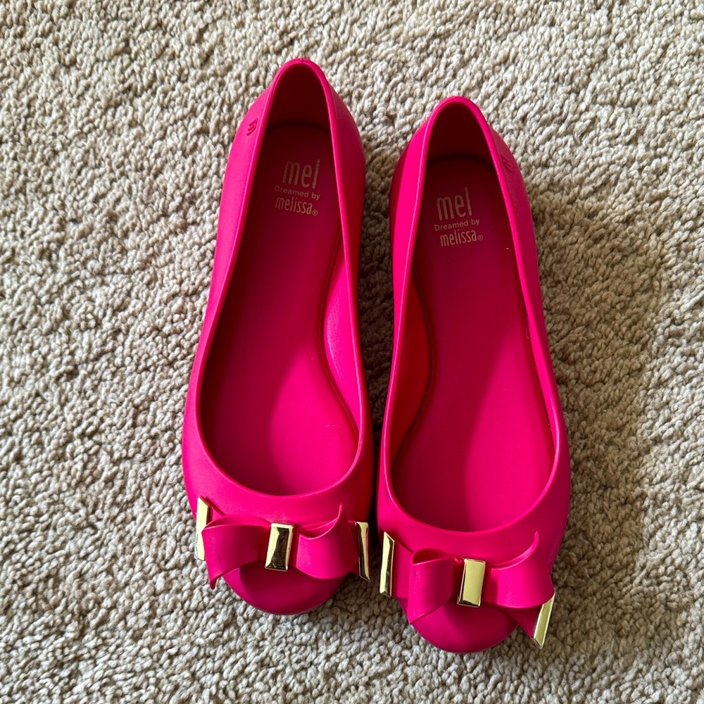 Mel Dreamed by Melissa Pink slides with gold trimmed bow